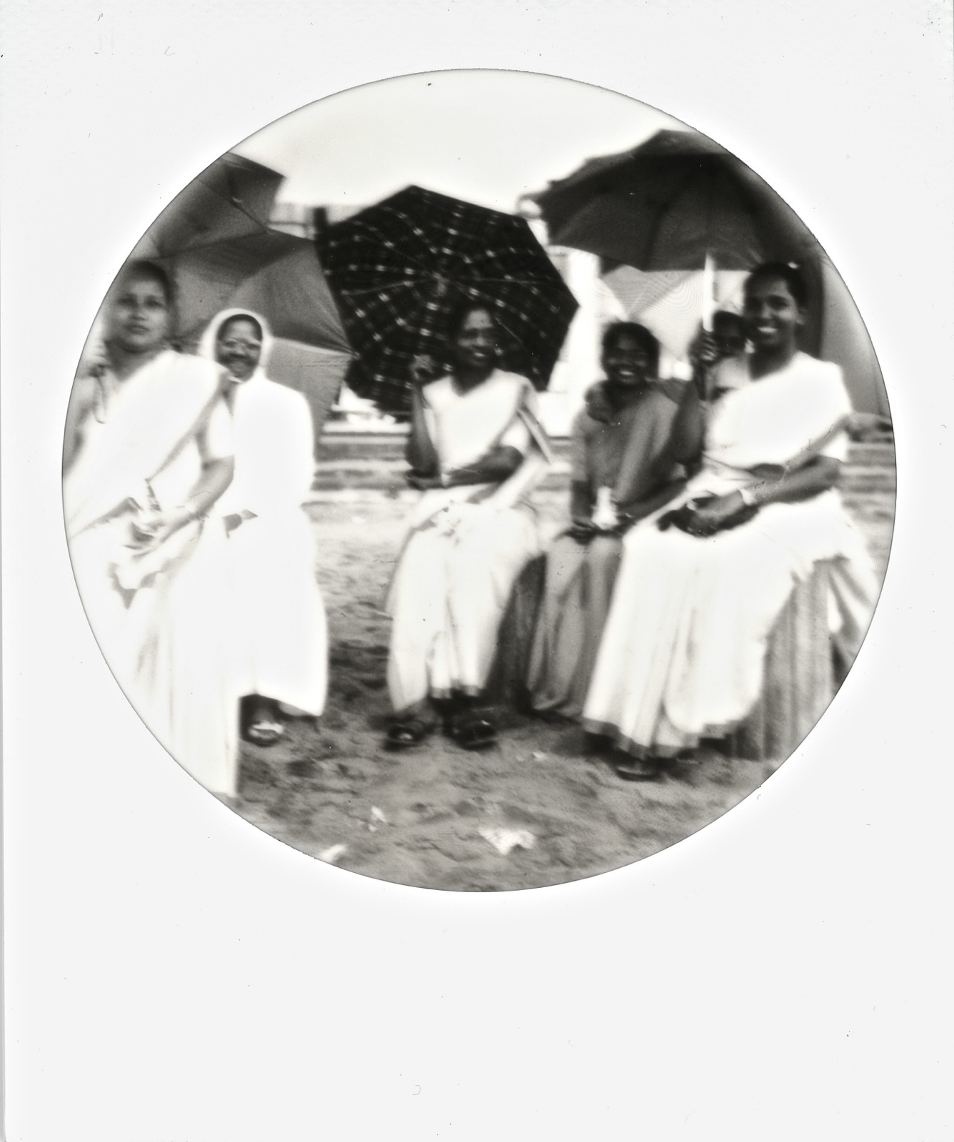 Ladies on the Beach Seeking Shelter from the Sun